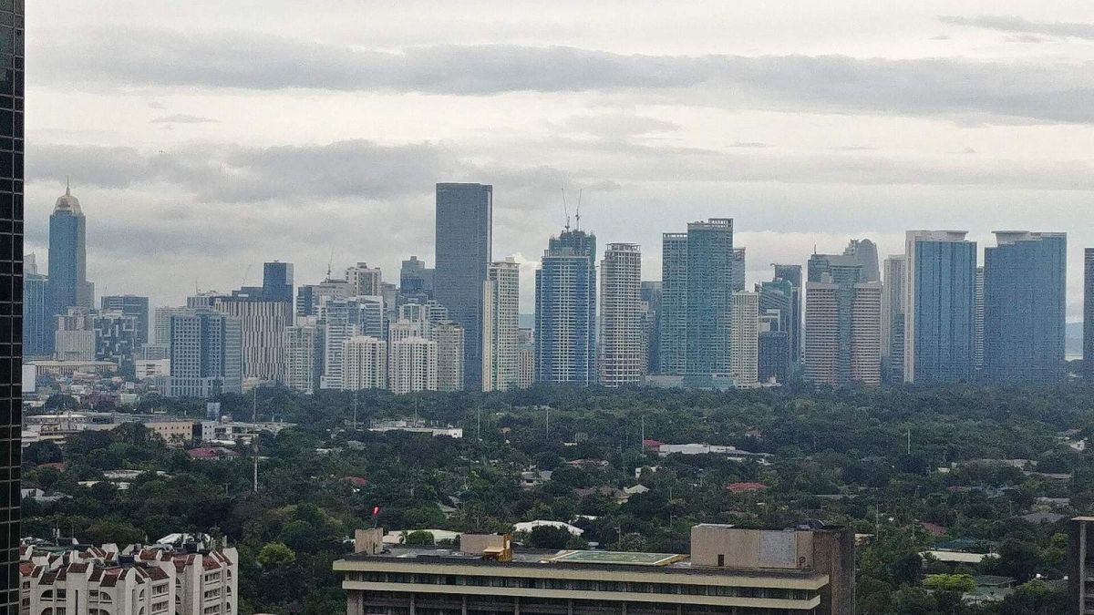 Skyline of high-rise office and residential towers in Bonifacio Global City, Metro Manila, seen over tree cover